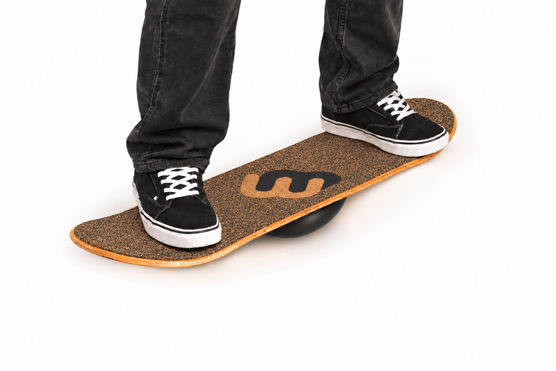 Feet in sneakers balancing on a Whirly Board Sport 360 balance board with a cork top