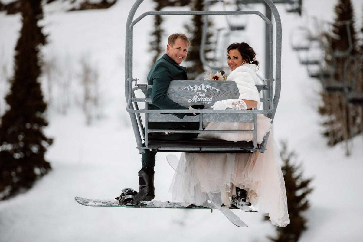 Erik and Joanna on a chairlift in Jackson Hole on their wedding day