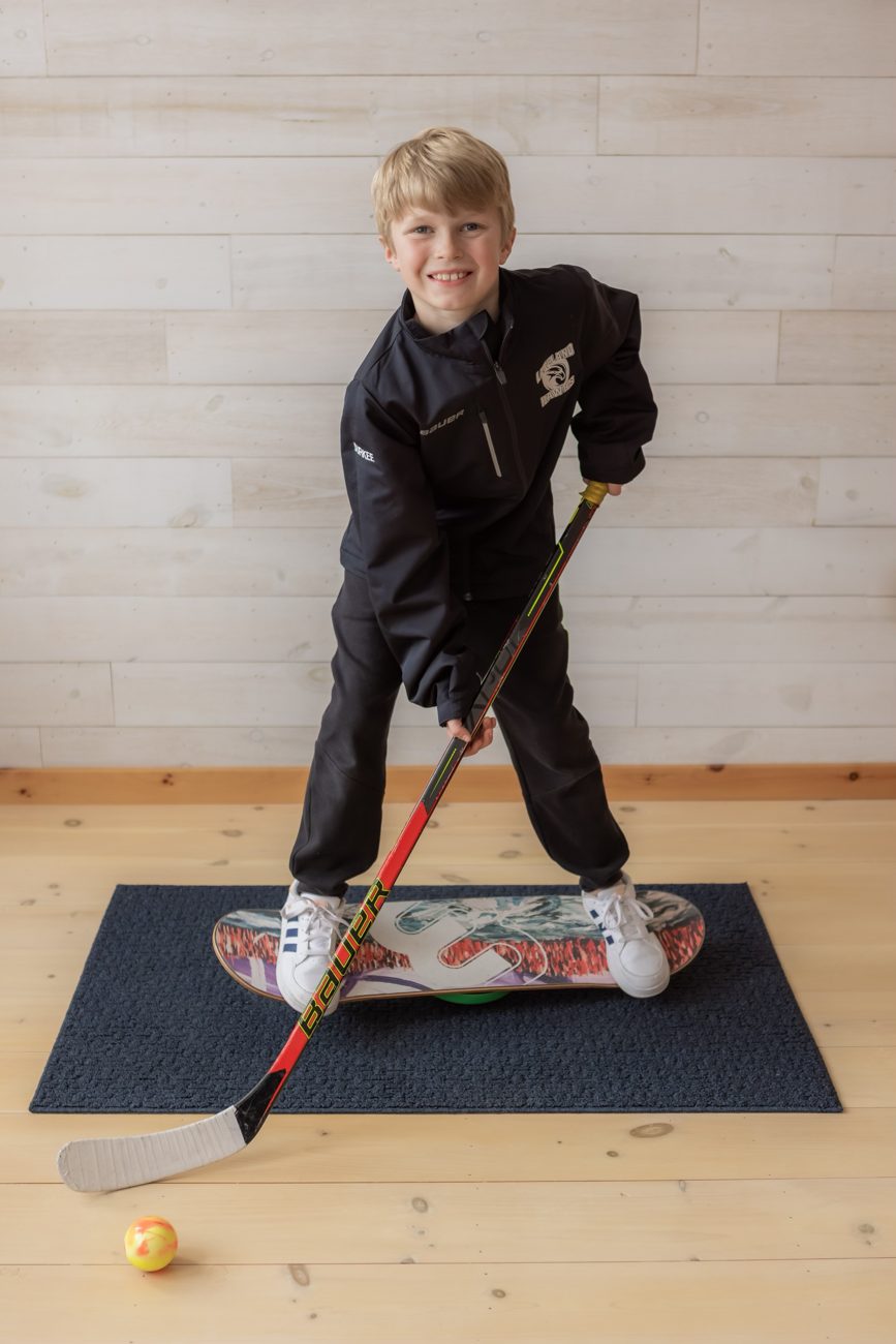 Boy doing a hockey drill on a Whirly Board