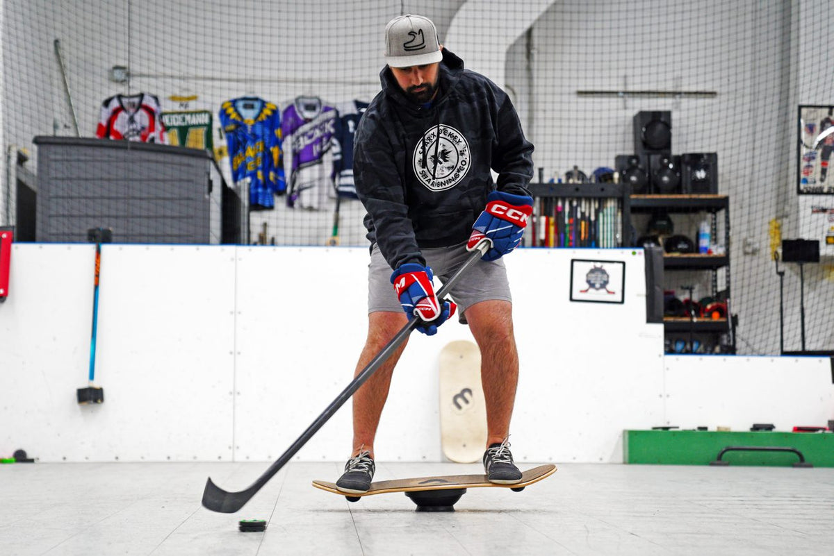 Hockey player stickhandling on a Whirly Board at the rink