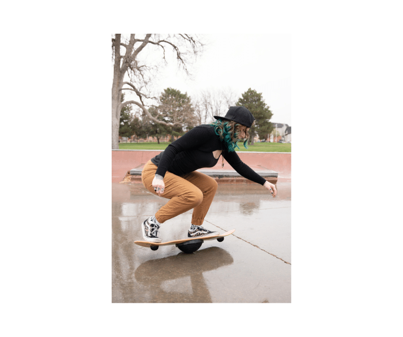 young woman does skateboard sports performance training on a Whirly Board